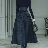 Dark blue turtleneck stretch top and plaid skirt set